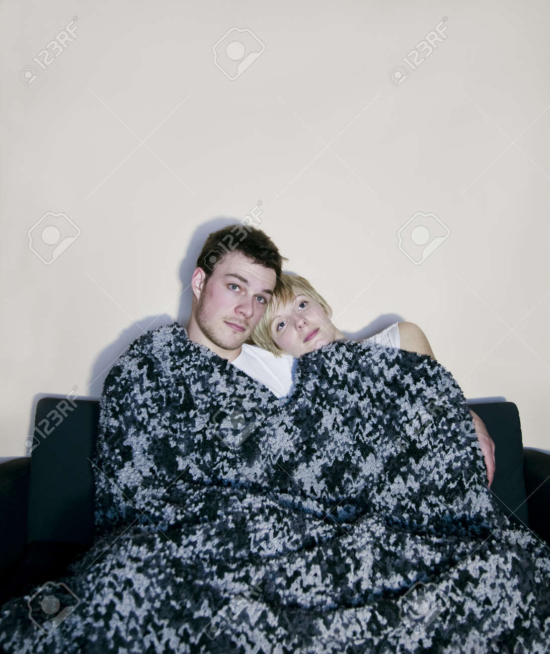 https://www.tempther.com/wp-content/uploads/2026/02/18308784-young-couple-watching-television-comfortably-wrapped-in-a-blanket.jpg